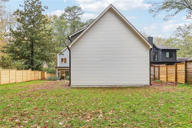 view of home's exterior with a lawn