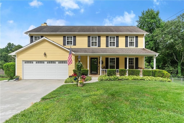 1083 Wash Lee Dr SW, Lilburn, GA 30047 - colonial inspired home with covered porch, driveway, a chimney, and an attached garage