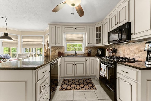 1083 Wash Lee Dr SW, Lilburn, GA 30047 - kitchen featuring black appliances, a peninsula, a ceiling fan, backsplash, and glass insert cabinets