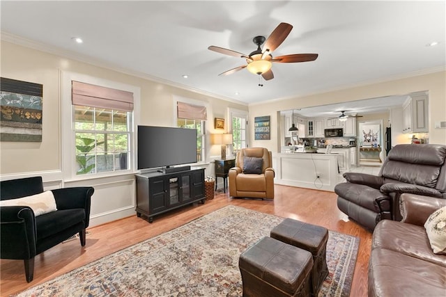 1083 Wash Lee Dr SW, Lilburn, GA 30047 - living area featuring ceiling fan, crown molding, and light wood finished floors