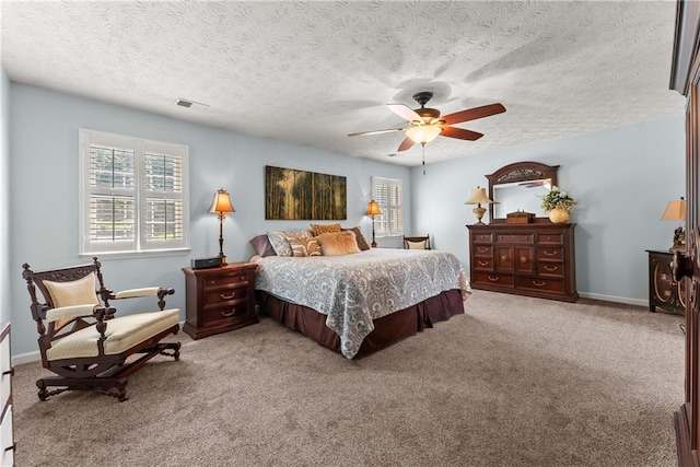 1083 Wash Lee Dr SW, Lilburn, GA 30047 - carpeted bedroom with multiple windows, a textured ceiling, and ceiling fan