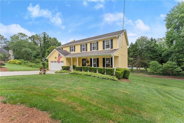1083 Wash Lee Dr SW, Lilburn, GA 30047 - colonial-style house with a porch, driveway, a front lawn, and a garage