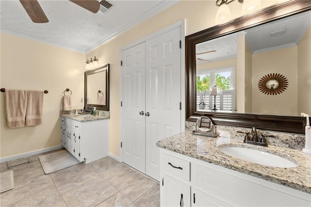 1083 Wash Lee Dr SW, Lilburn, GA 30047 - full bath with ceiling fan, two vanities, ornamental molding, and a textured ceiling
