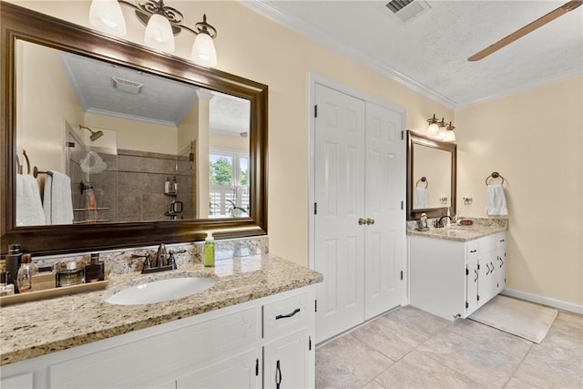 1083 Wash Lee Dr SW, Lilburn, GA 30047 - full bath with a stall shower, two vanities, ornamental molding, a textured ceiling, and tile patterned flooring