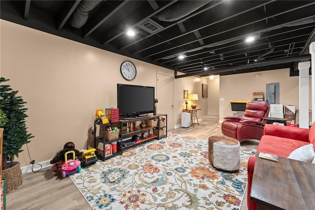 1083 Wash Lee Dr SW, Lilburn, GA 30047 - living room with wood finished floors and electric panel