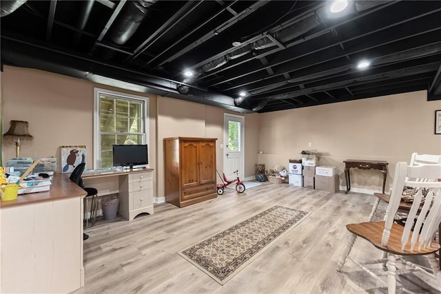 1083 Wash Lee Dr SW, Lilburn, GA 30047 - below grade area featuring a desk and wood finished floors