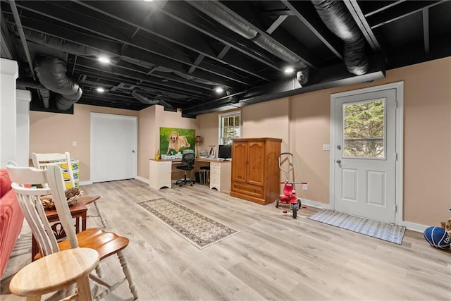 1083 Wash Lee Dr SW, Lilburn, GA 30047 - below grade area with light wood finished floors and a desk