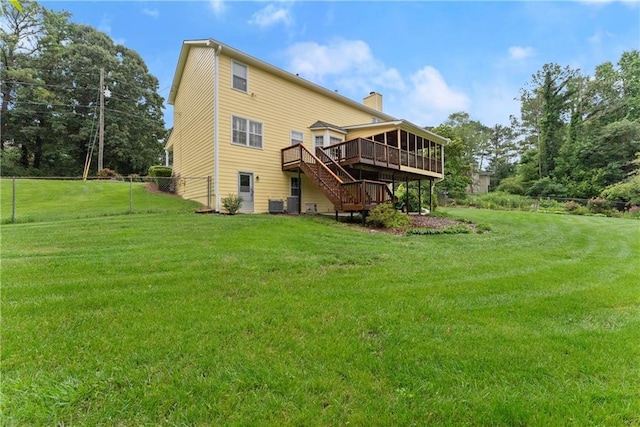 1083 Wash Lee Dr SW, Lilburn, GA 30047 - back of house featuring stairs, a wooden deck, a chimney, and a sunroom
