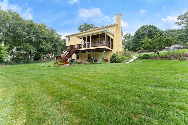 1083 Wash Lee Dr SW, Lilburn, GA 30047 - rear view of property featuring a sunroom, stairs, a chimney, a wooden deck, and a fenced backyard
