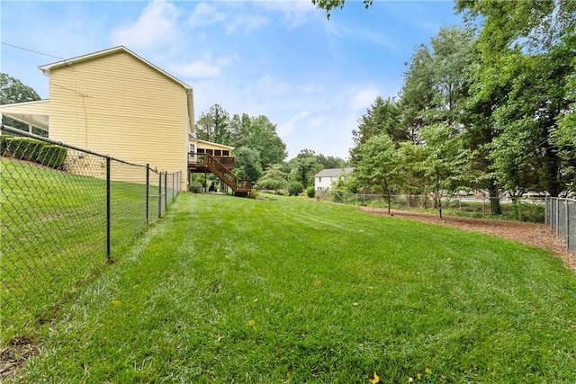 1083 Wash Lee Dr SW, Lilburn, GA 30047 - fenced backyard featuring stairway and a deck