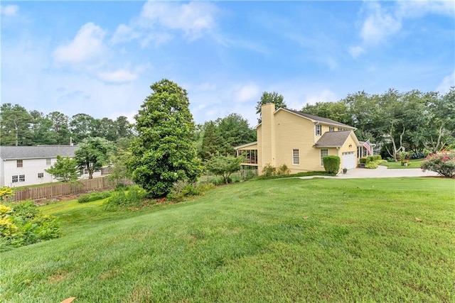 1083 Wash Lee Dr SW, Lilburn, GA 30047 - view of yard with a garage and driveway