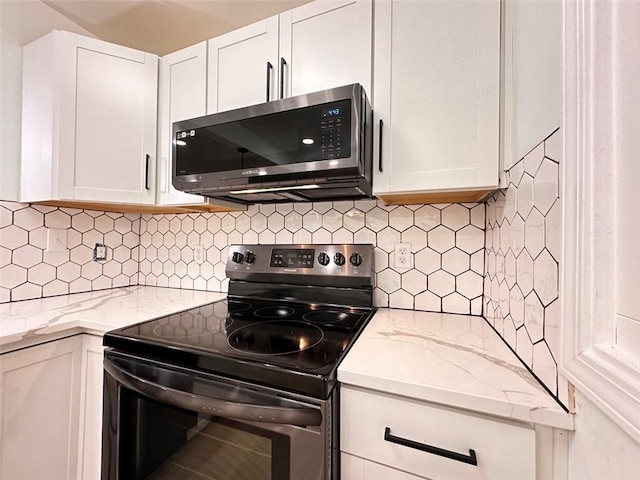 kitchen with white cabinets, electric stove, tasteful backsplash, and light stone counters