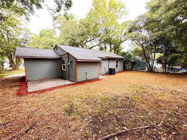 rear view of house featuring a patio and central air condition unit