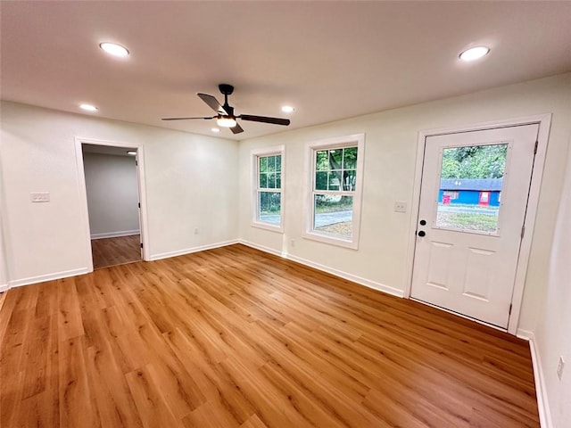 foyer entrance with plenty of natural light, light hardwood / wood-style flooring, and ceiling fan