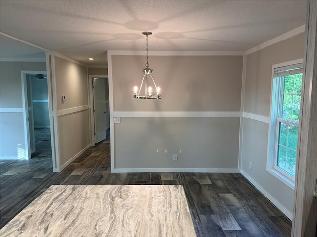 5251 Bogus Rd, Gainesville, GA 30506 - unfurnished dining area with ornamental molding, a chandelier, plenty of natural light, dark wood-type flooring, and a textured ceiling