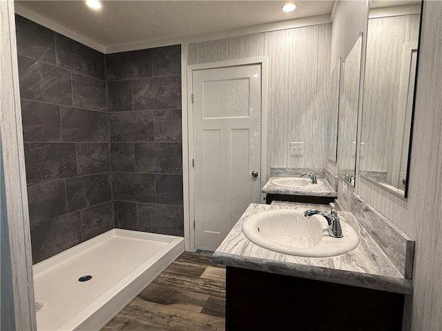 5251 Bogus Rd, Gainesville, GA 30506 - full bathroom featuring vanity, wood finished floors, recessed lighting, and a tile shower