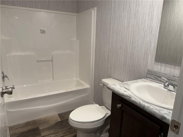 5251 Bogus Rd, Gainesville, GA 30506 - full bath featuring vanity, wood finished floors, and shower / bath combination