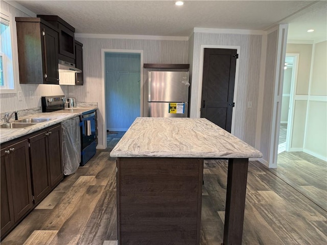 5251 Bogus Rd, Gainesville, GA 30506 - kitchen with freestanding refrigerator, crown molding, electric range, dark wood-type flooring, and under cabinet range hood