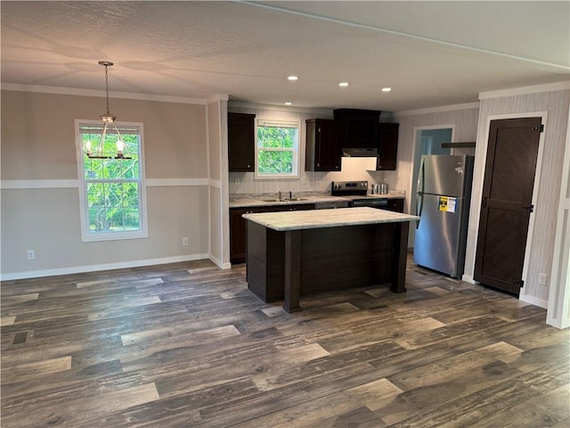 5251 Bogus Rd, Gainesville, GA 30506 - kitchen with appliances with stainless steel finishes, a center island, ornamental molding, dark wood-style flooring, and a chandelier