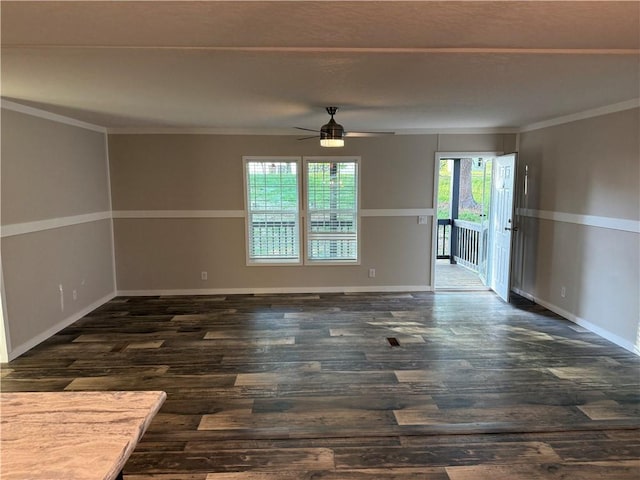 5251 Bogus Rd, Gainesville, GA 30506 - spare room featuring dark wood finished floors, ceiling fan, and ornamental molding