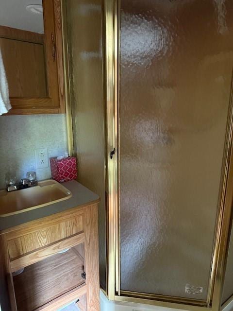 full bath with vanity and a stall shower
