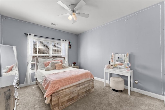 bedroom with a ceiling fan, baseboards, visible vents, and carpet flooring