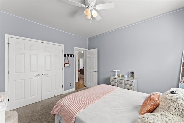 bedroom with baseboards, a closet, a ceiling fan, and carpet flooring