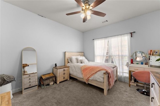 bedroom featuring a ceiling fan, visible vents, and carpet flooring