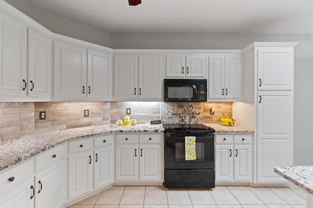 kitchen featuring black appliances, light tile patterned floors, white cabinetry, and decorative backsplash