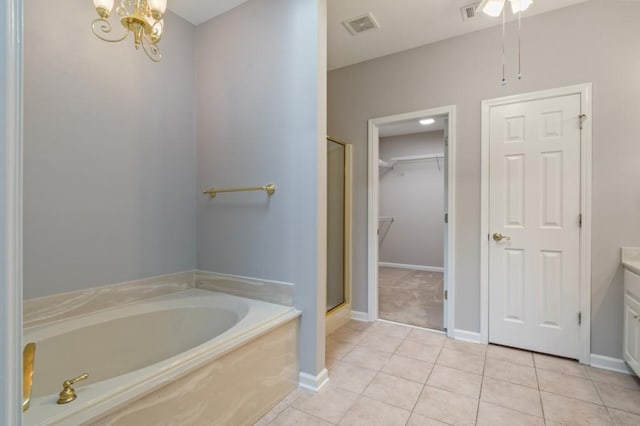 bathroom featuring a garden tub, tile patterned flooring, vanity, visible vents, and a stall shower