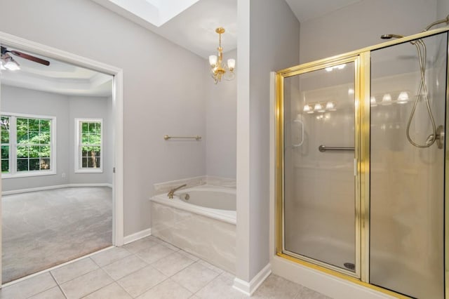 bathroom with a stall shower, baseboards, ceiling fan, tile patterned flooring, and a bath