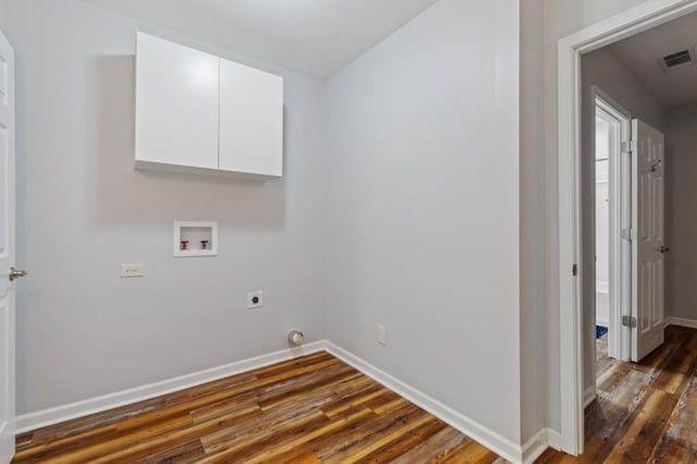 washroom featuring visible vents, hookup for a washing machine, electric dryer hookup, and dark wood-style floors