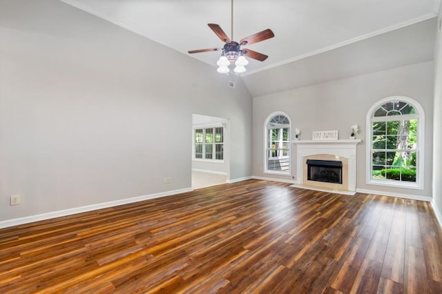 unfurnished living room with a fireplace with flush hearth, ceiling fan, wood finished floors, high vaulted ceiling, and baseboards