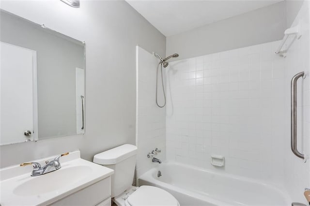 bathroom featuring toilet, vanity, and  shower combination