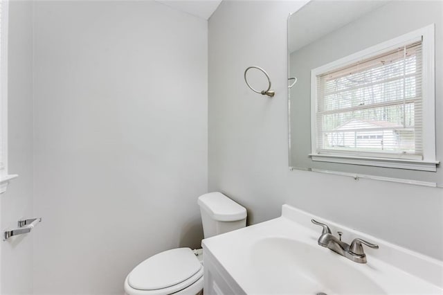 bathroom with toilet and a sink