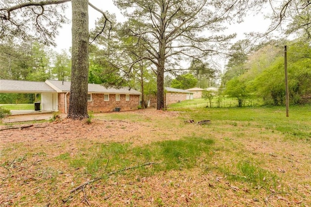 view of yard featuring a carport
