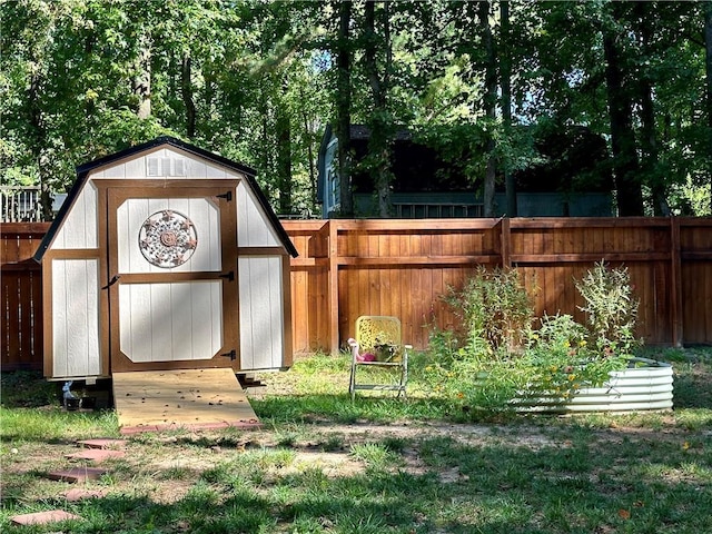 view of shed with a fenced backyard