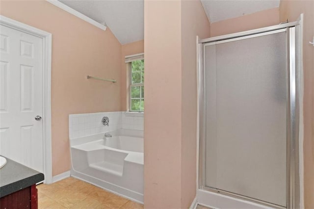 5865 El Segundo Way, Atlanta, GA 30349 - full bath featuring a shower stall, a bath, vanity, and lofted ceiling
