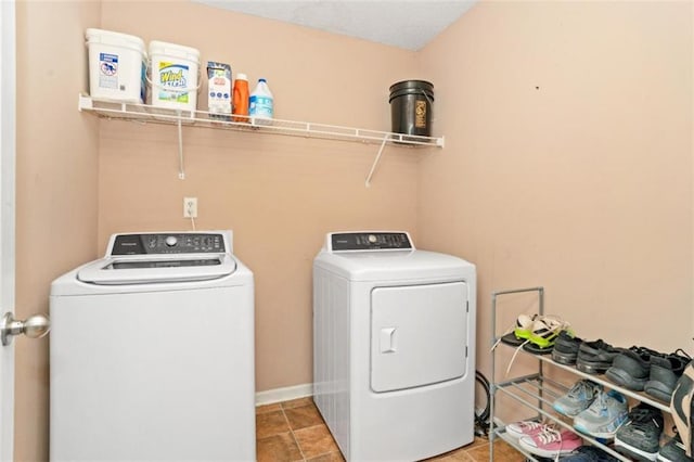 5865 El Segundo Way, Atlanta, GA 30349 - washroom featuring washer and clothes dryer and tile patterned flooring