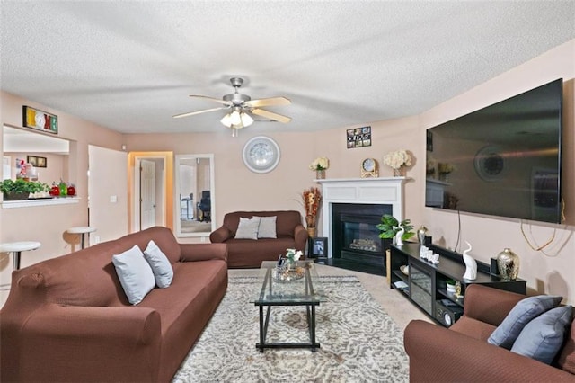 5865 El Segundo Way, Atlanta, GA 30349 - living area featuring ceiling fan, a textured ceiling, and a fireplace with flush hearth