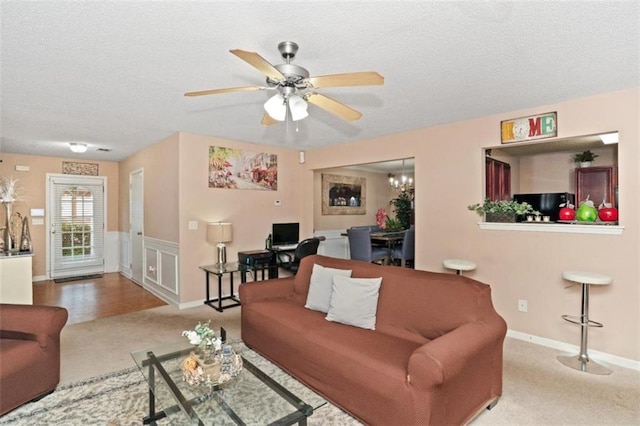 5865 El Segundo Way, Atlanta, GA 30349 - carpeted living area with a textured ceiling and a ceiling fan