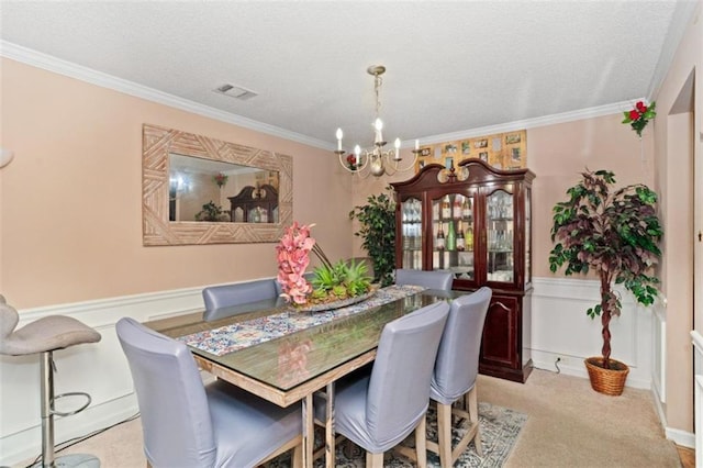 5865 El Segundo Way, Atlanta, GA 30349 - dining room featuring a textured ceiling, a wainscoted wall, a chandelier, crown molding, and light carpet
