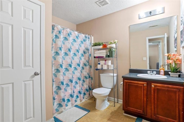 5865 El Segundo Way, Atlanta, GA 30349 - bathroom with vanity, a textured ceiling, a shower with shower curtain, and tile patterned flooring