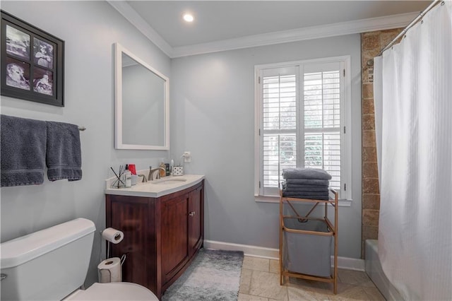 full bath featuring toilet, crown molding, vanity, baseboards, and tile patterned flooring