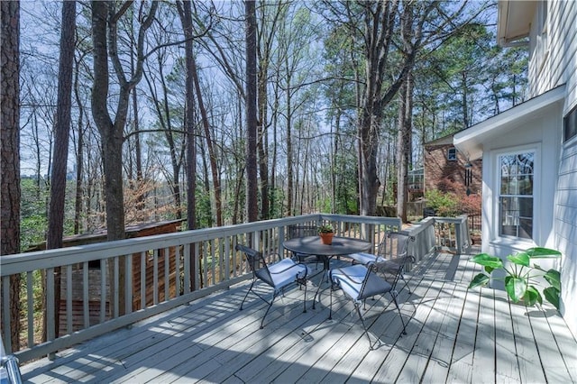 wooden deck with outdoor dining space