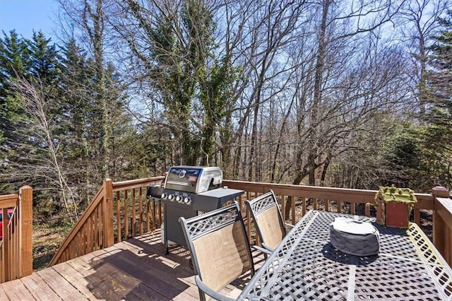 wooden terrace featuring outdoor dining space