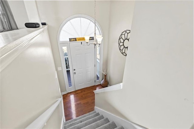 entryway featuring stairway and wood finished floors