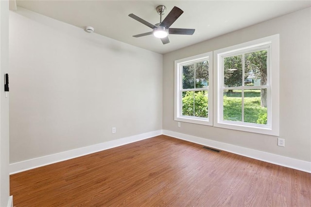 2081 Verbena St NW, Atlanta, GA 30314 - empty room featuring dark wood-type flooring, ceiling fan, and a smoke detector
