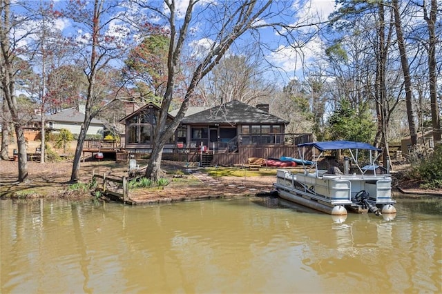 view of dock featuring a deck with water view