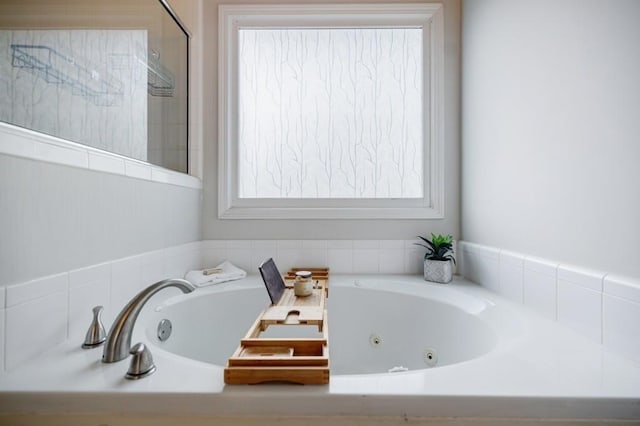 bathroom with tiled tub